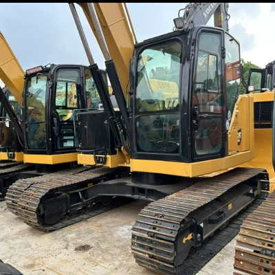 Excavadora hidráulica de agarre giratorio CAT 310 para manejo de madera